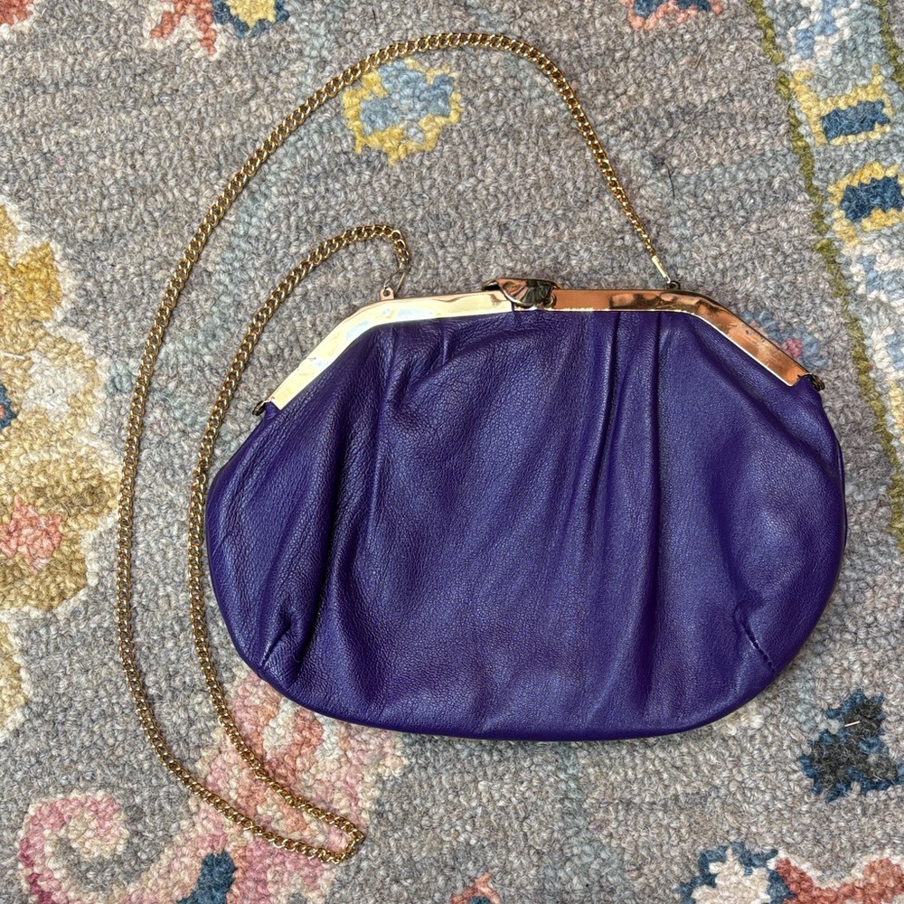 Vintage genuine leather bag in a rich purple